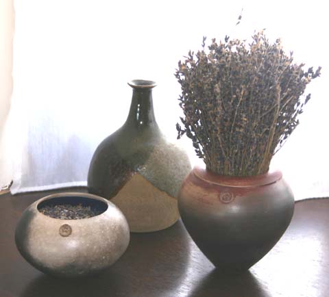 My bottle lurking behind two of Hugh�s wonderful raku pots